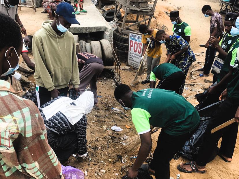 Team members cleaning market area